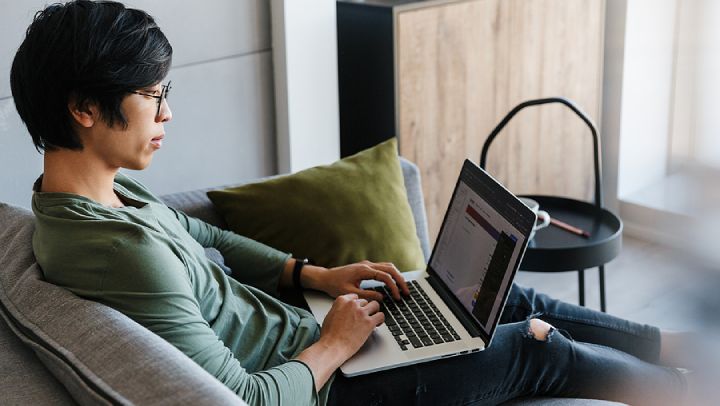 Man working on laptop in Australia